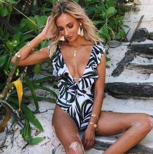 Glow Chic's Ruffle One-Piece Swimsuit – Push-Up Monokini with Backless Design and Bold Print